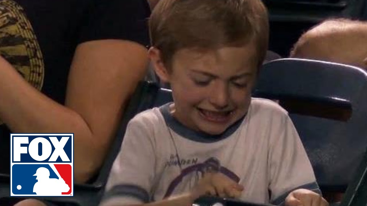 Kid struggles to crack peanut at Twins-Angels game